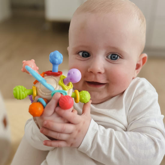 Minkštas barškutis 2in1 kramtukas-sensorinis žaislas kūdikiams.WOOPIE BABY